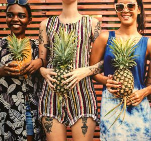 is-pineapple-good-for-digestion-women-holding-fruit